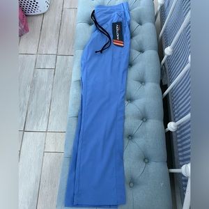 2 shirt and 2 pants Never worn. Size small.